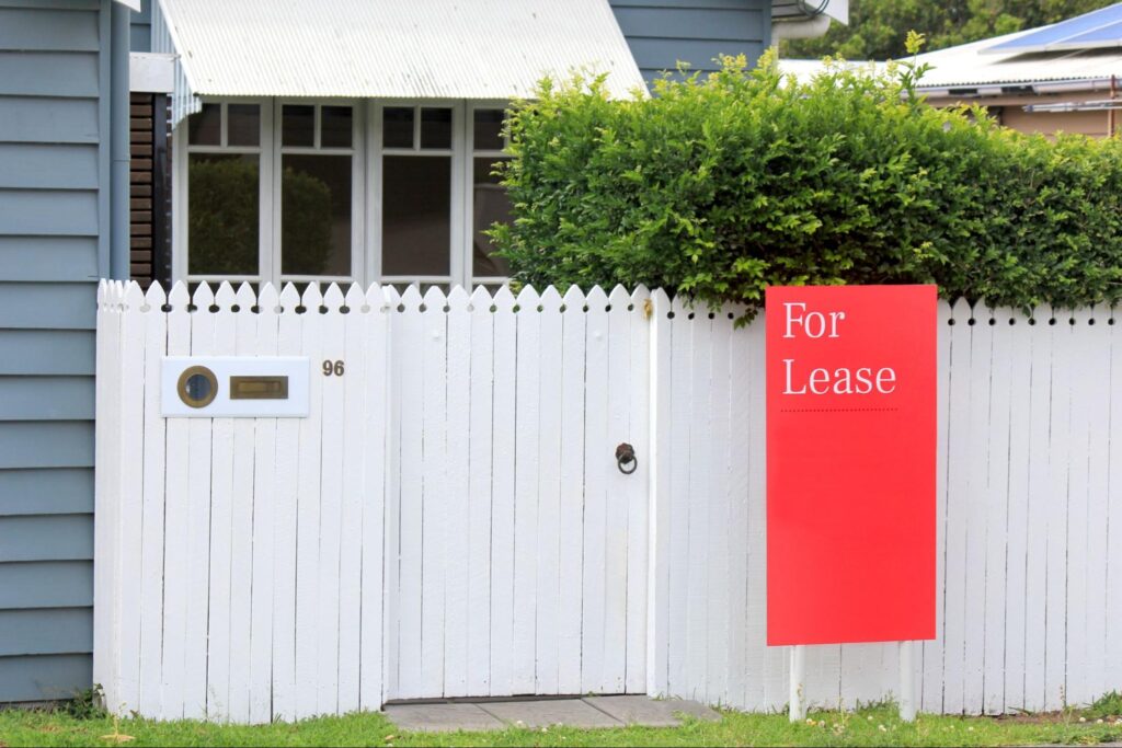 house with a for lease sign